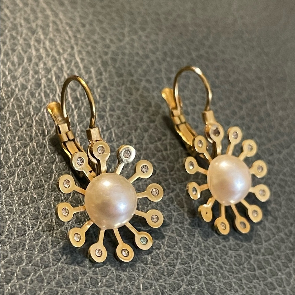 A lot of 3, 2 gold filled earrings and one set of silver tone hoops. Jewelry